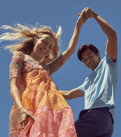 Dancing couple under blue sky